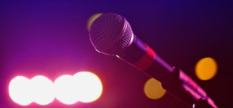 Meet the Band Managers: A Guide to Music Management - microphone on stage