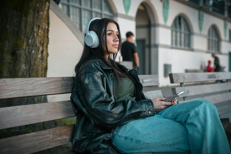 How Are The Music Charts Calculated? - Woman listening to music