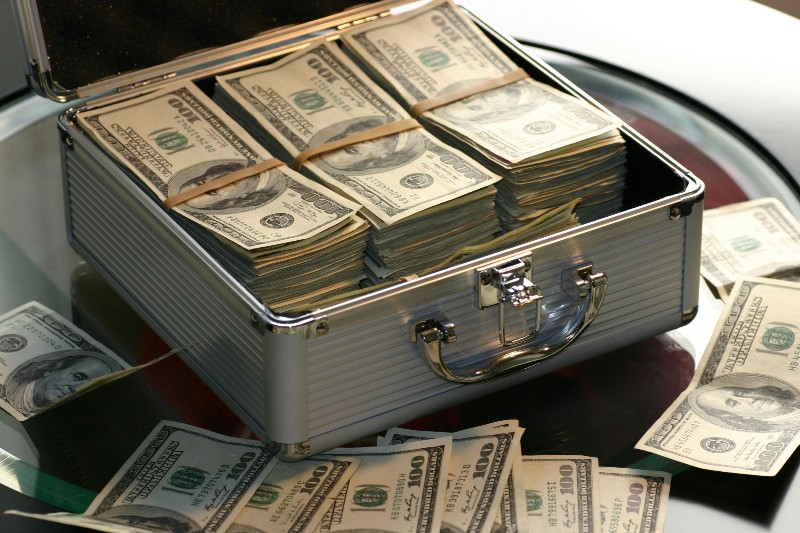 Streaming Royalty Calculator: What Your Streams Are Worth - US Dollars in briefcase